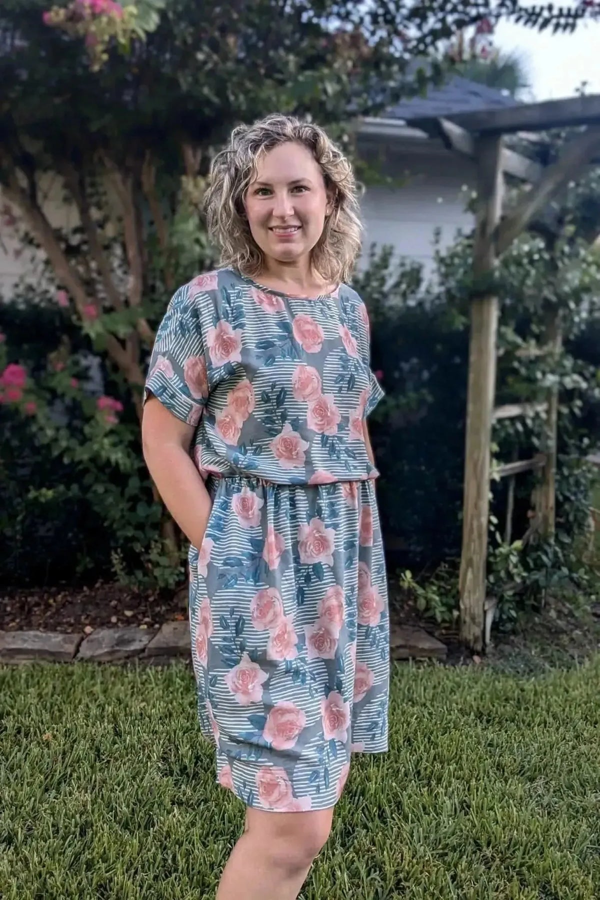 Wild Rose floral print fabric in green with pink roses.