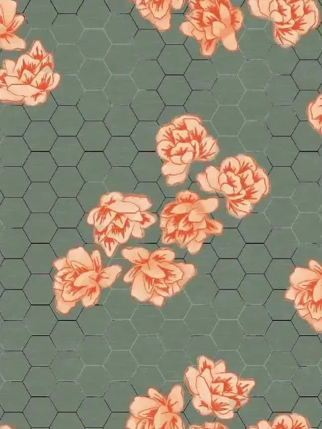 A green fabric with a honeycomb pattern and scattered orange floral designs.