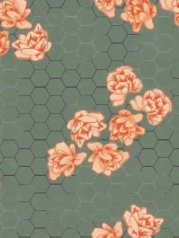 Green honeycomb pattern with scattered orange floral motifs on fabric.