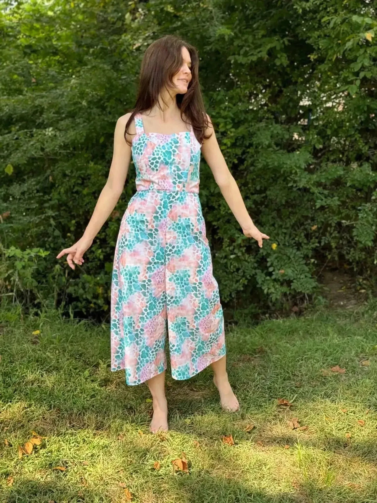 Vibrant abstract print fabric with wild heart motifs in pink, green, and blue tones.