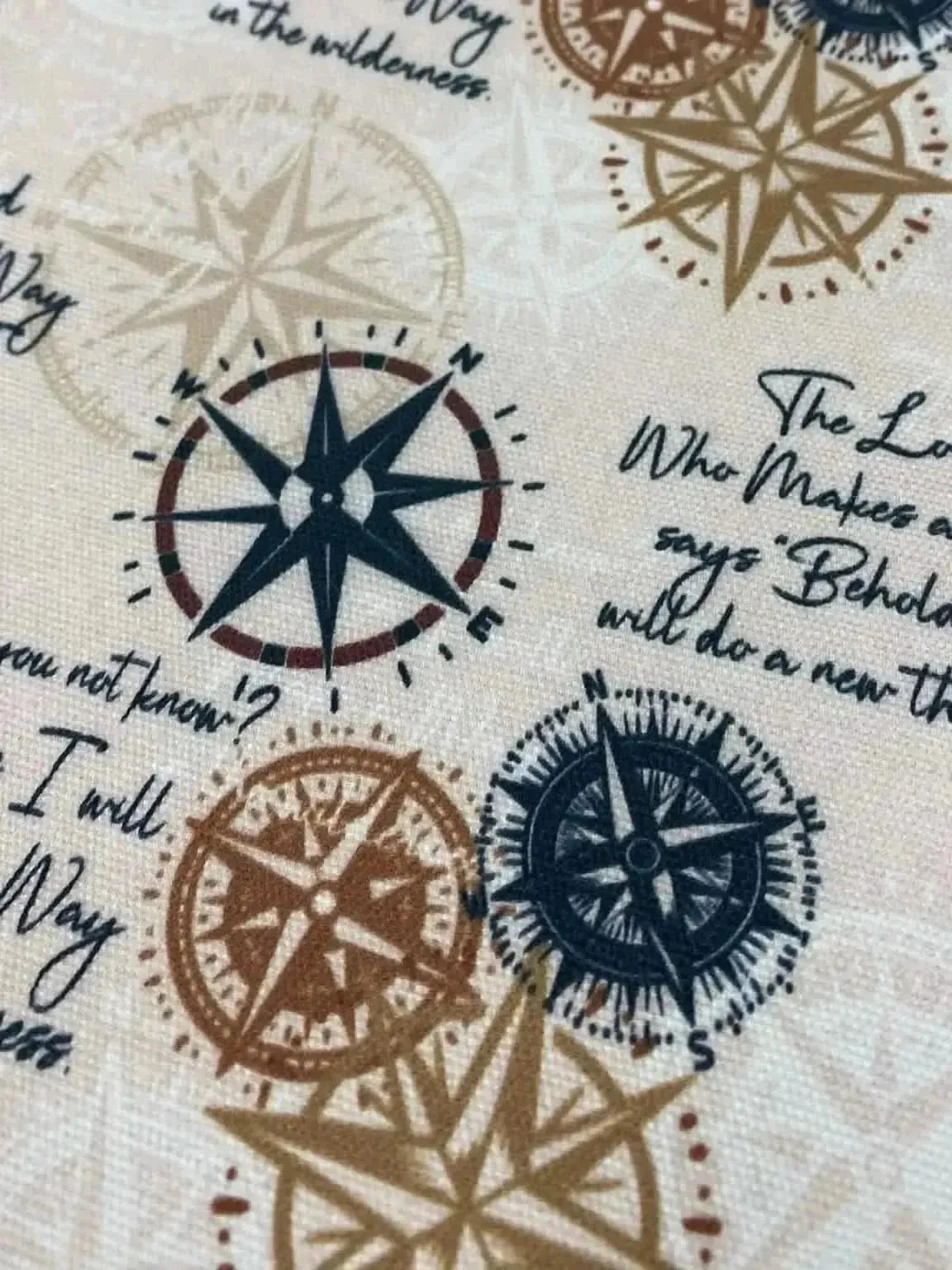 Blue-brown fabric with compass motifs and "WayMaker" scripture print.
