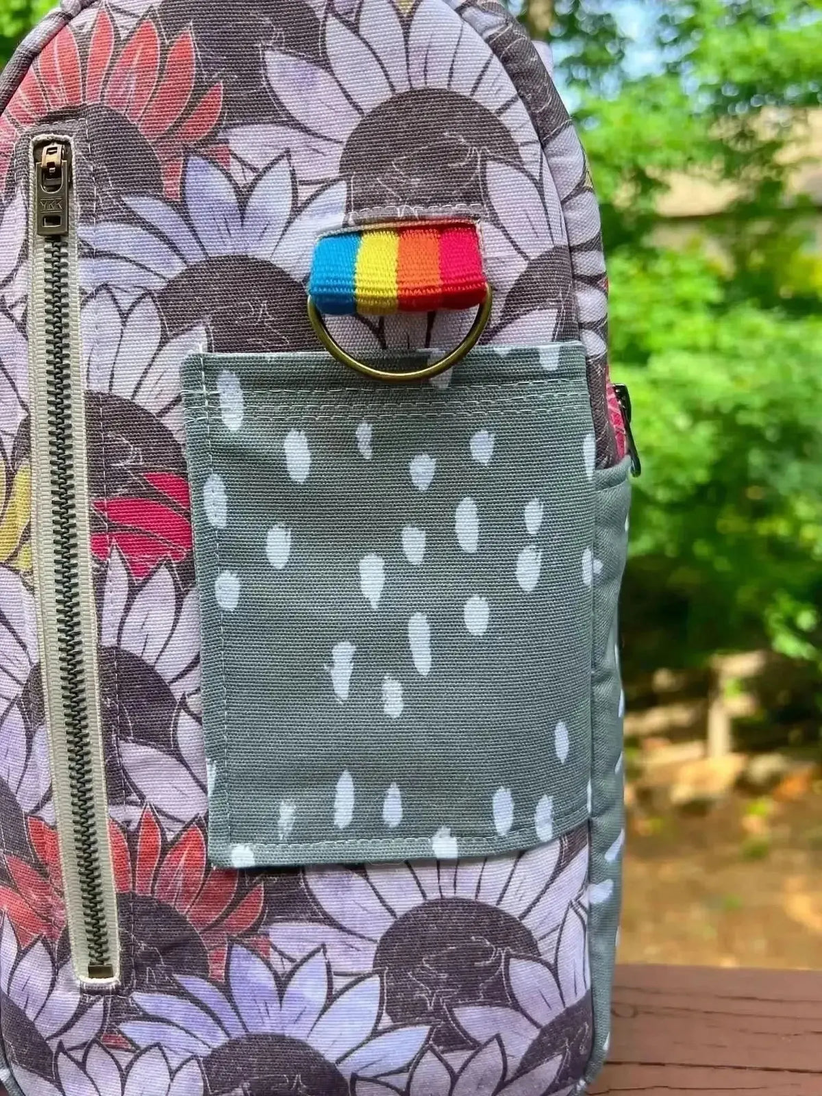 Vibrant sunflower print fabric with purple and brown tones.