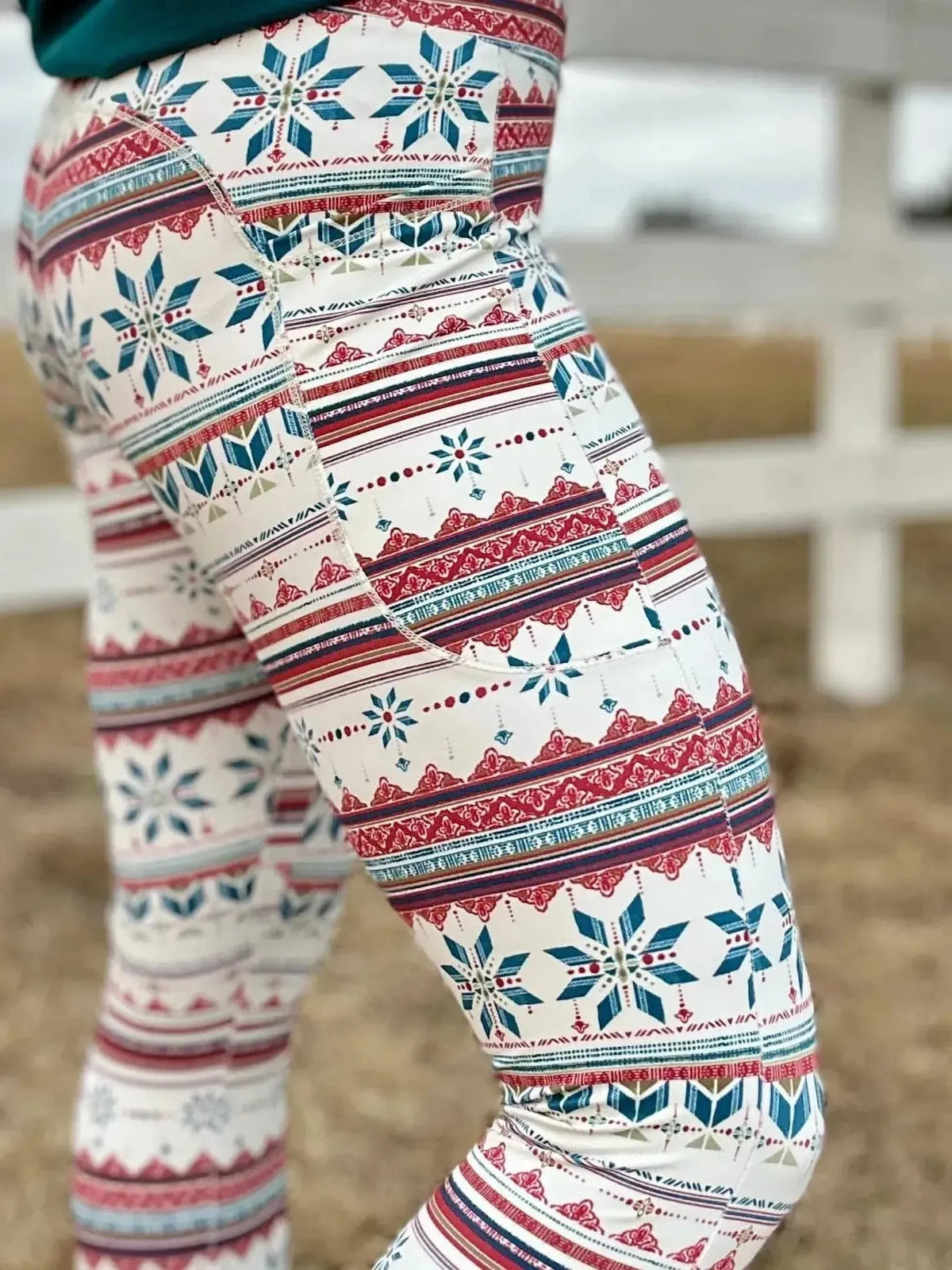 White leggings with red and blue Fair Isle snowflake pattern.