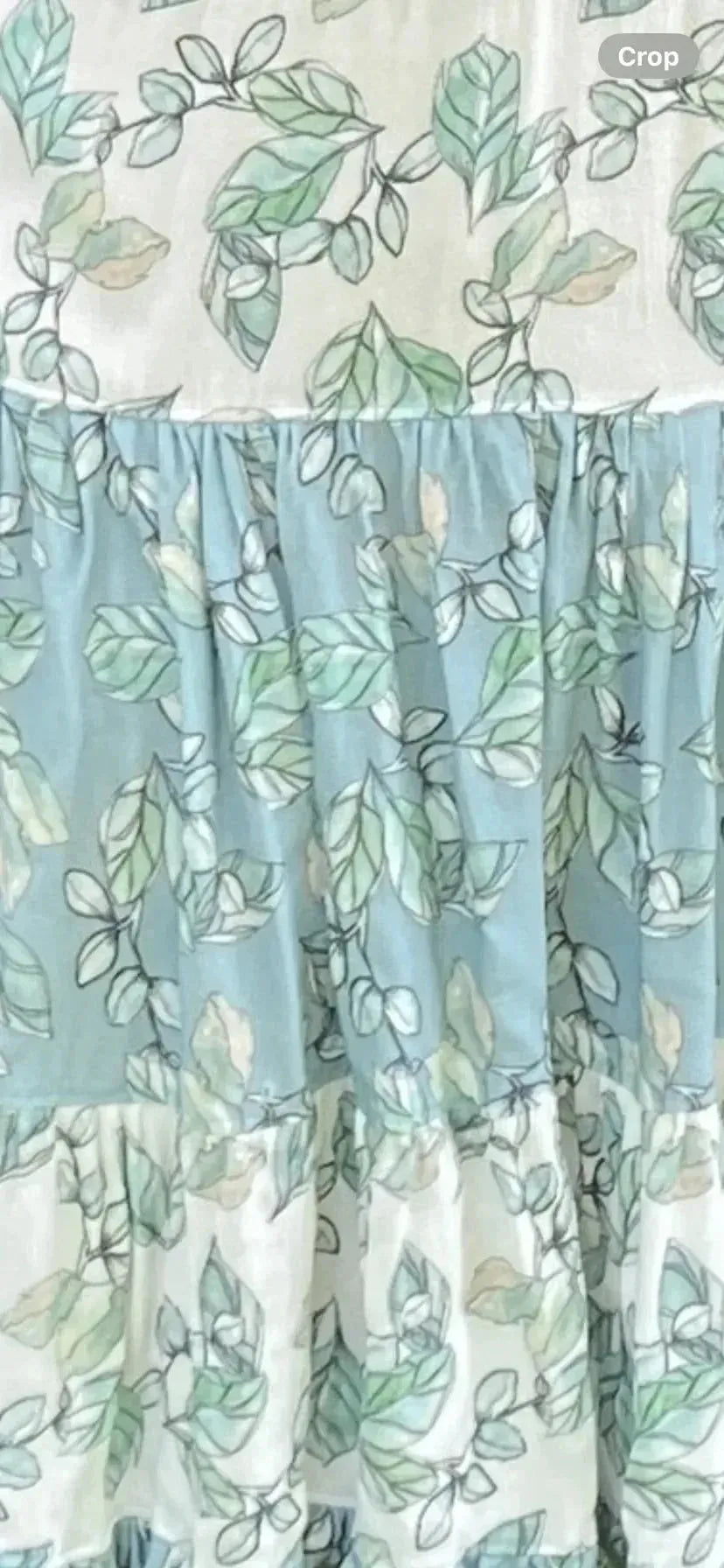White fabric with green eucalyptus leaf print from Willow Lane collection.