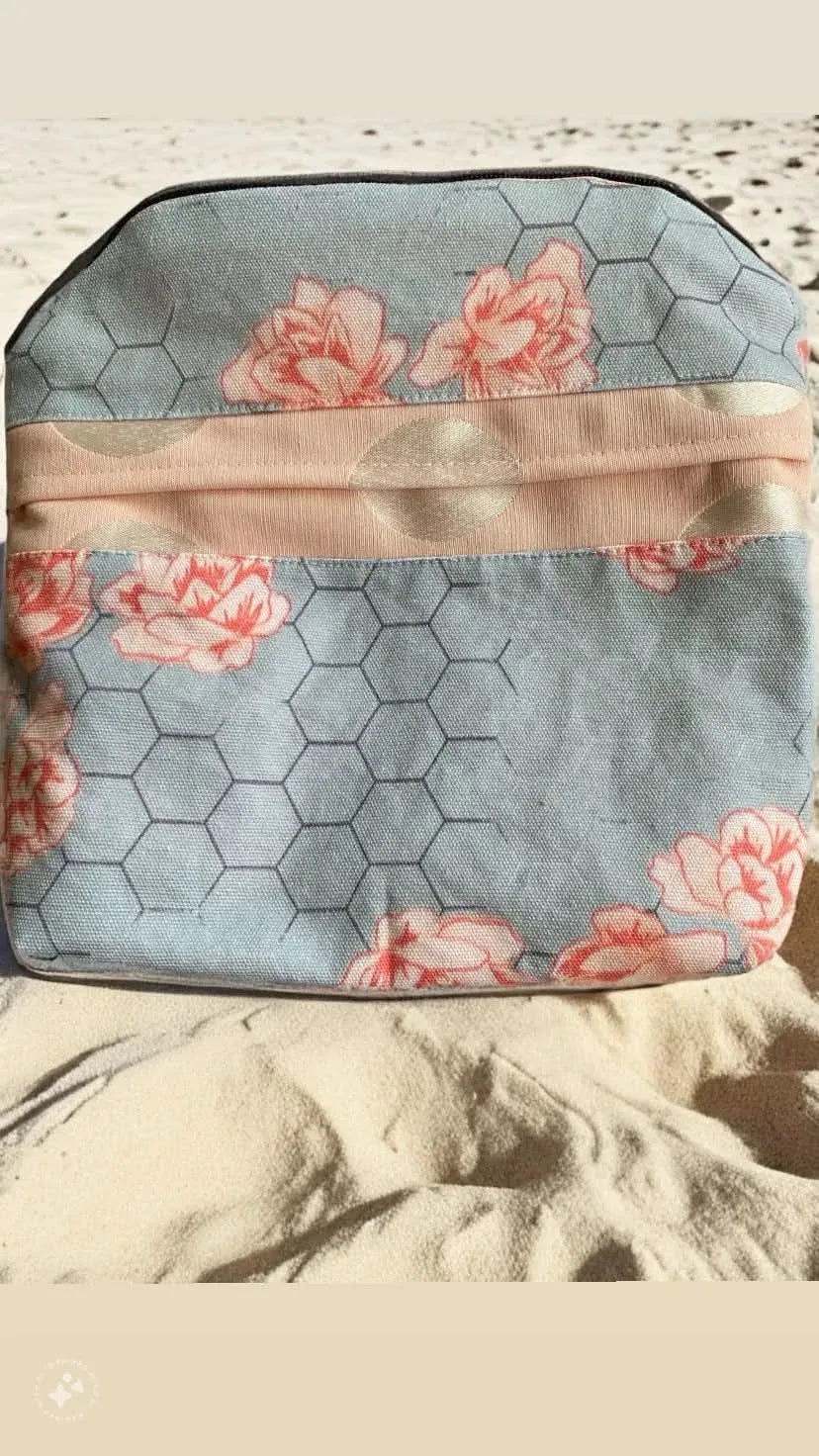 Honeycomb floral fabric with pink flowers and a honeycomb pattern.