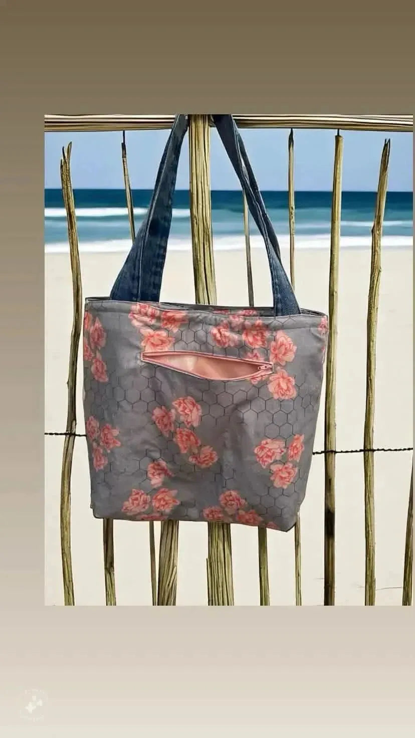 Honeycomb floral fabric with nature-inspired print in soft pink and gray tones.