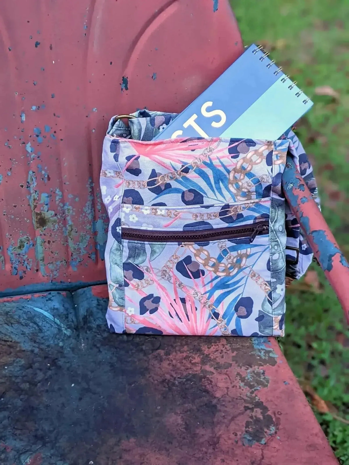 Luxe leopard print fabric with pink, blue, and purple floral accents.