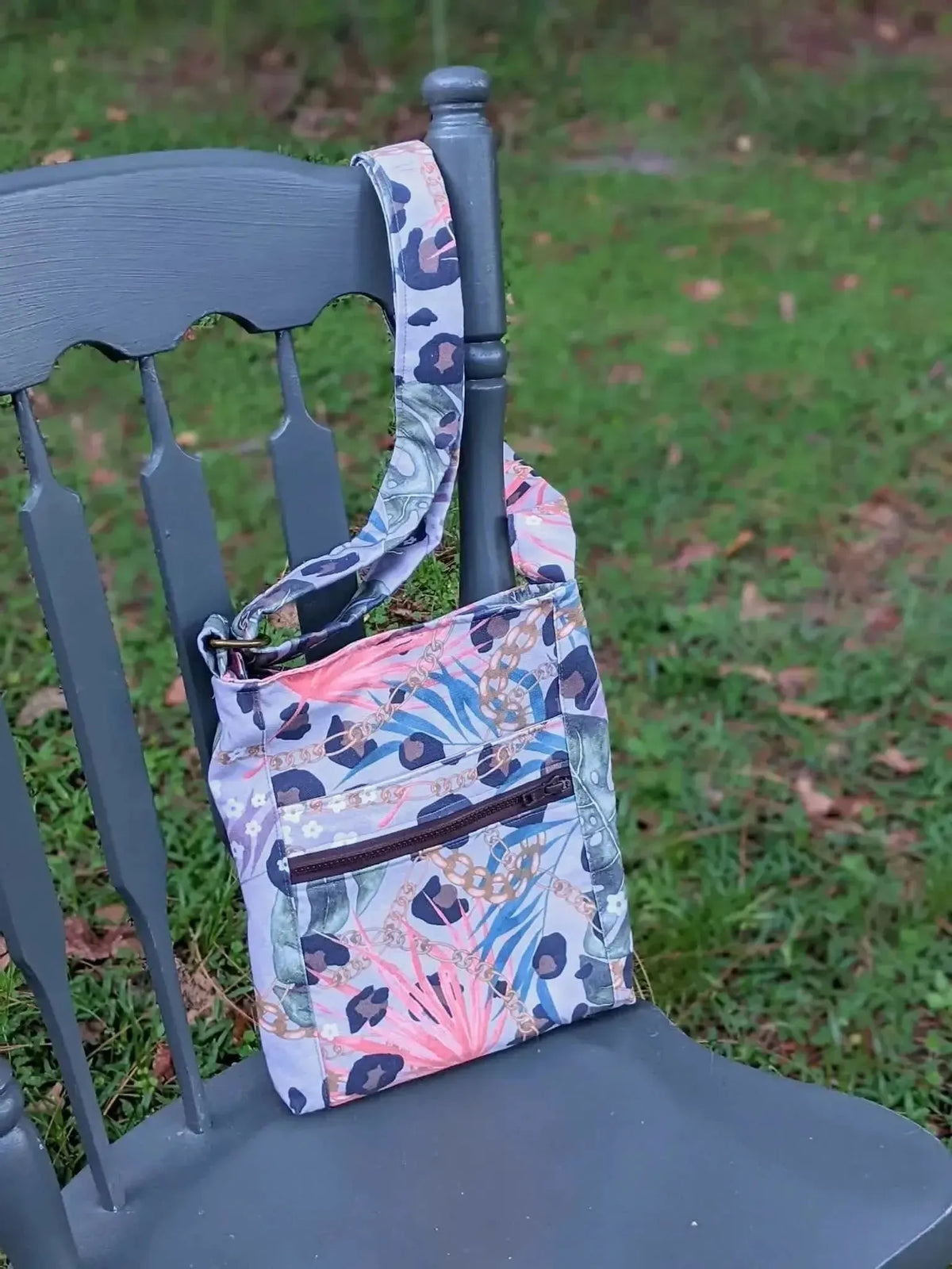 Luxe leopard print fabric with pink, blue, and green floral accents.