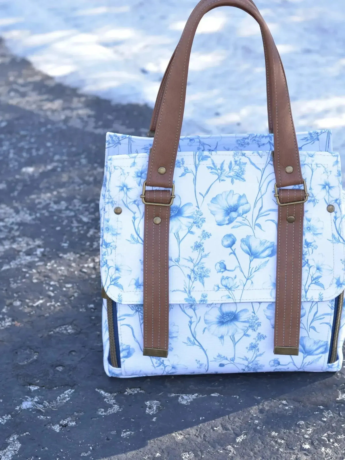 Blue garden symphony botanical print fabric with white floral pattern on blue background.