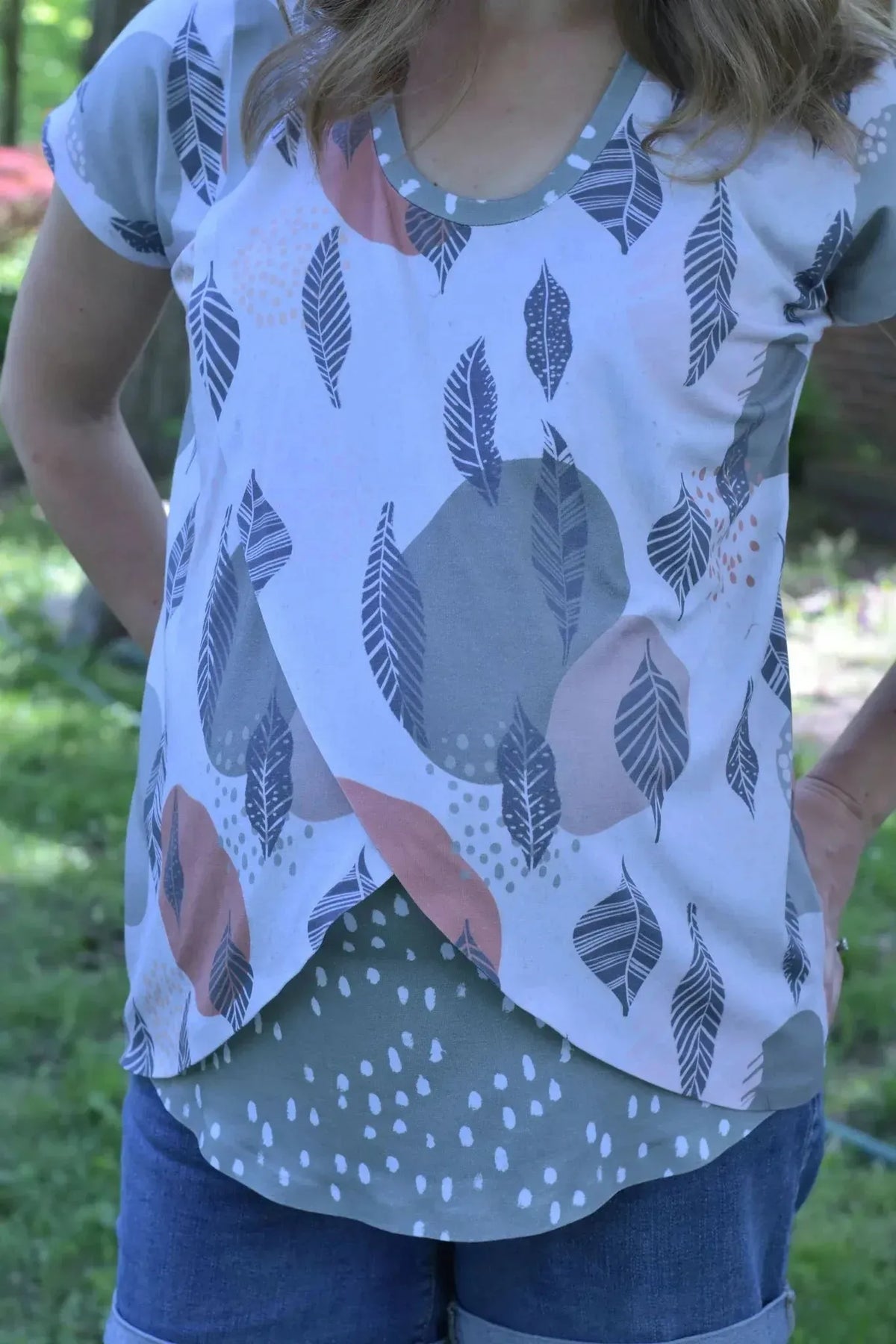 Olive abstract dots fabric with leaf and circle patterns in gray, white, and pink tones.