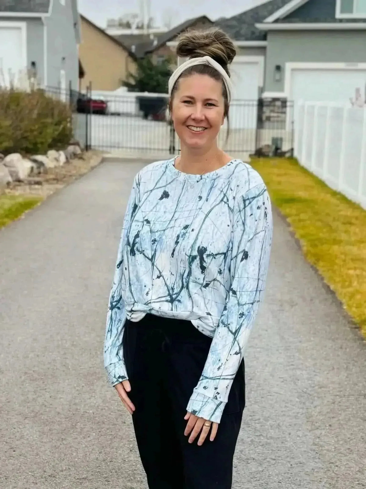 White cracked ice abstract print fabric with swirling gray patterns on a light background.
