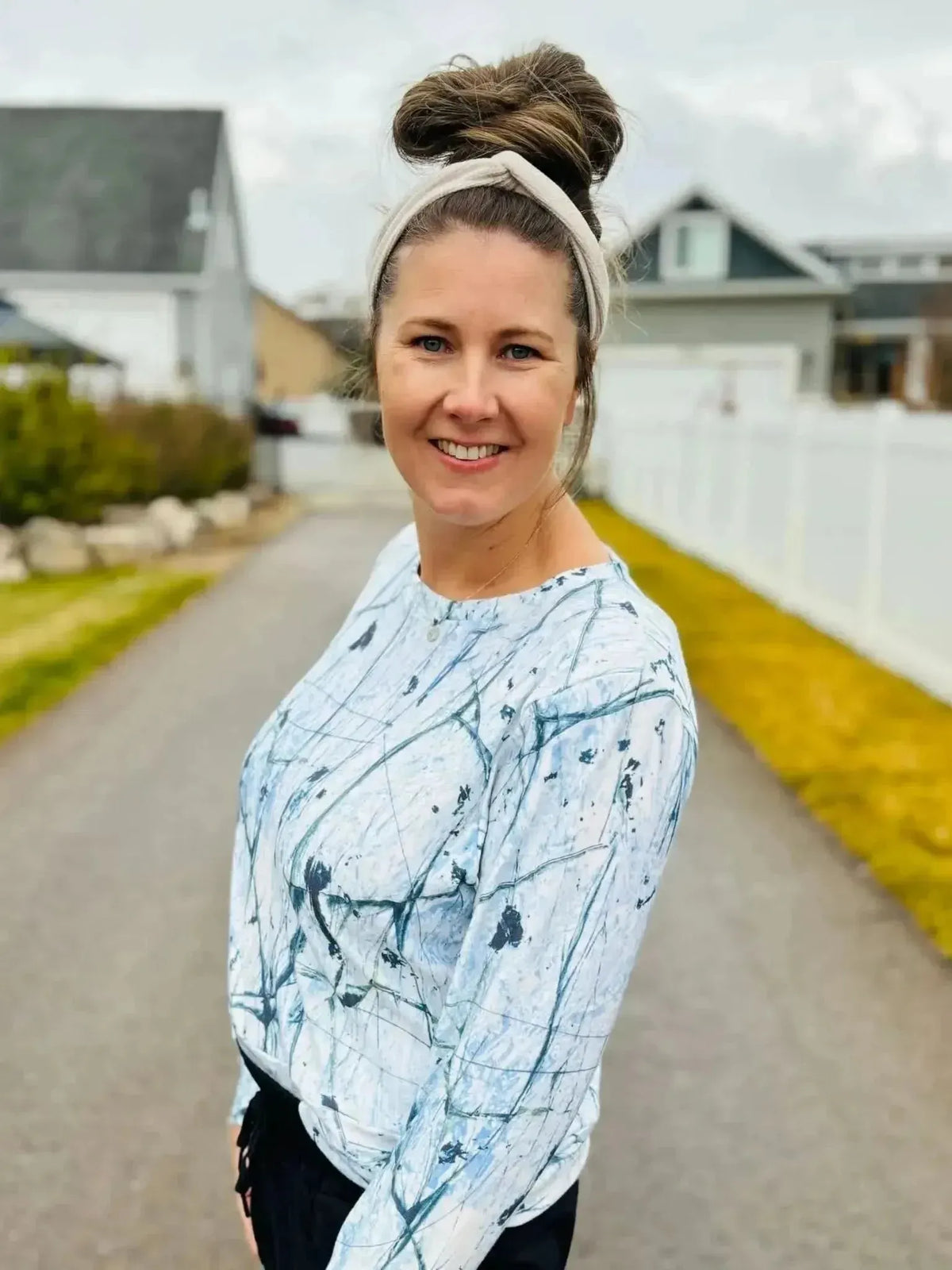White cracked ice abstract print fabric with gray veining on a light background.