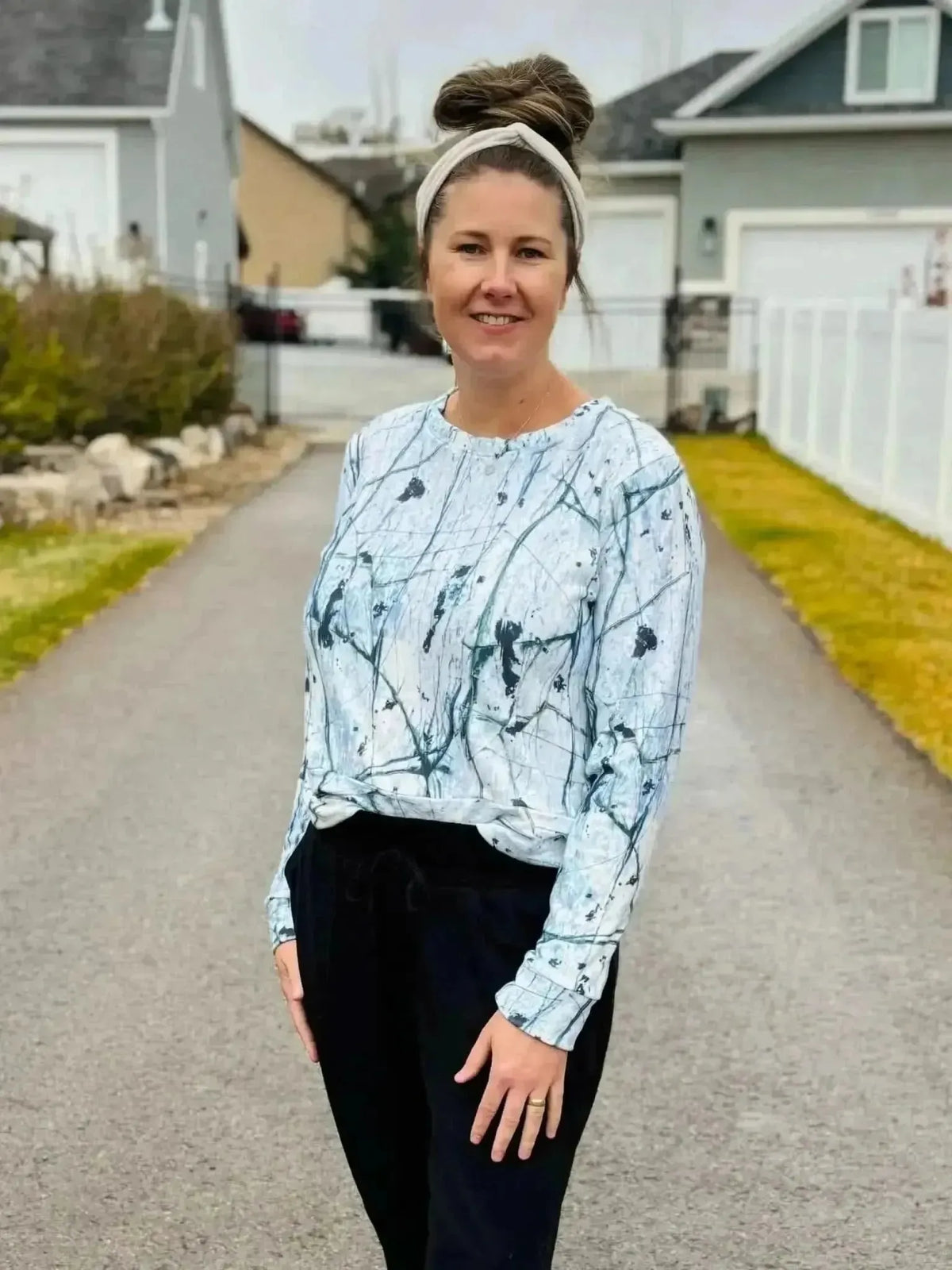 White cracked ice abstract print fabric with swirling gray patterns on a light background.