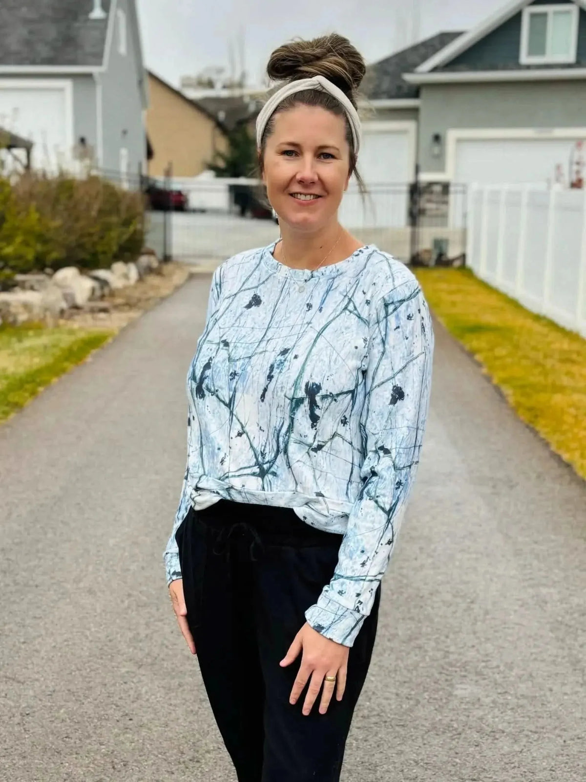 White cracked ice abstract print fabric with swirling gray patterns on a light background.