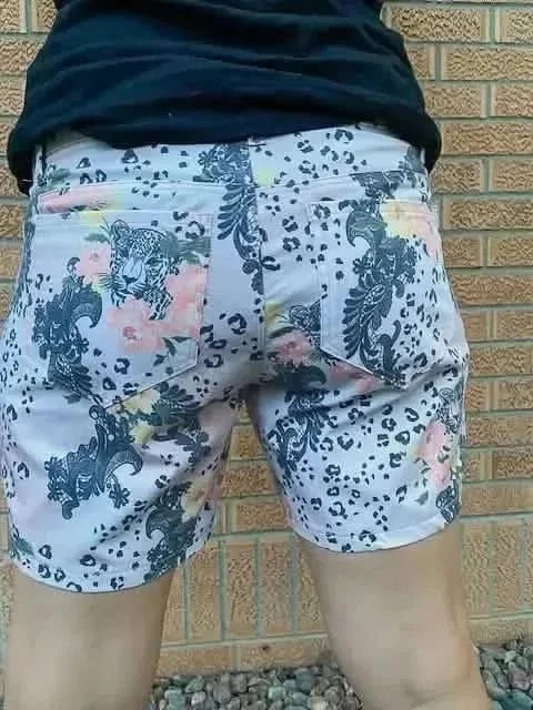 Light pink leopard print fabric with lace-like floral patterns on a white background.