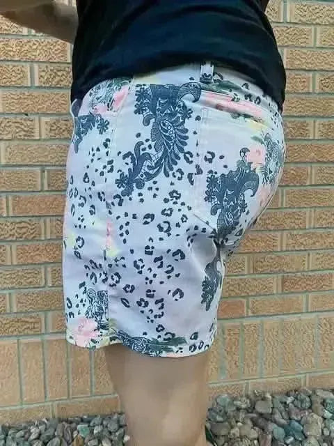 Light pink leopard print fabric with lace-like floral patterns.