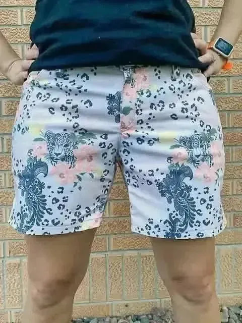 Light pink leopard print fabric with floral lace accents on a white background.