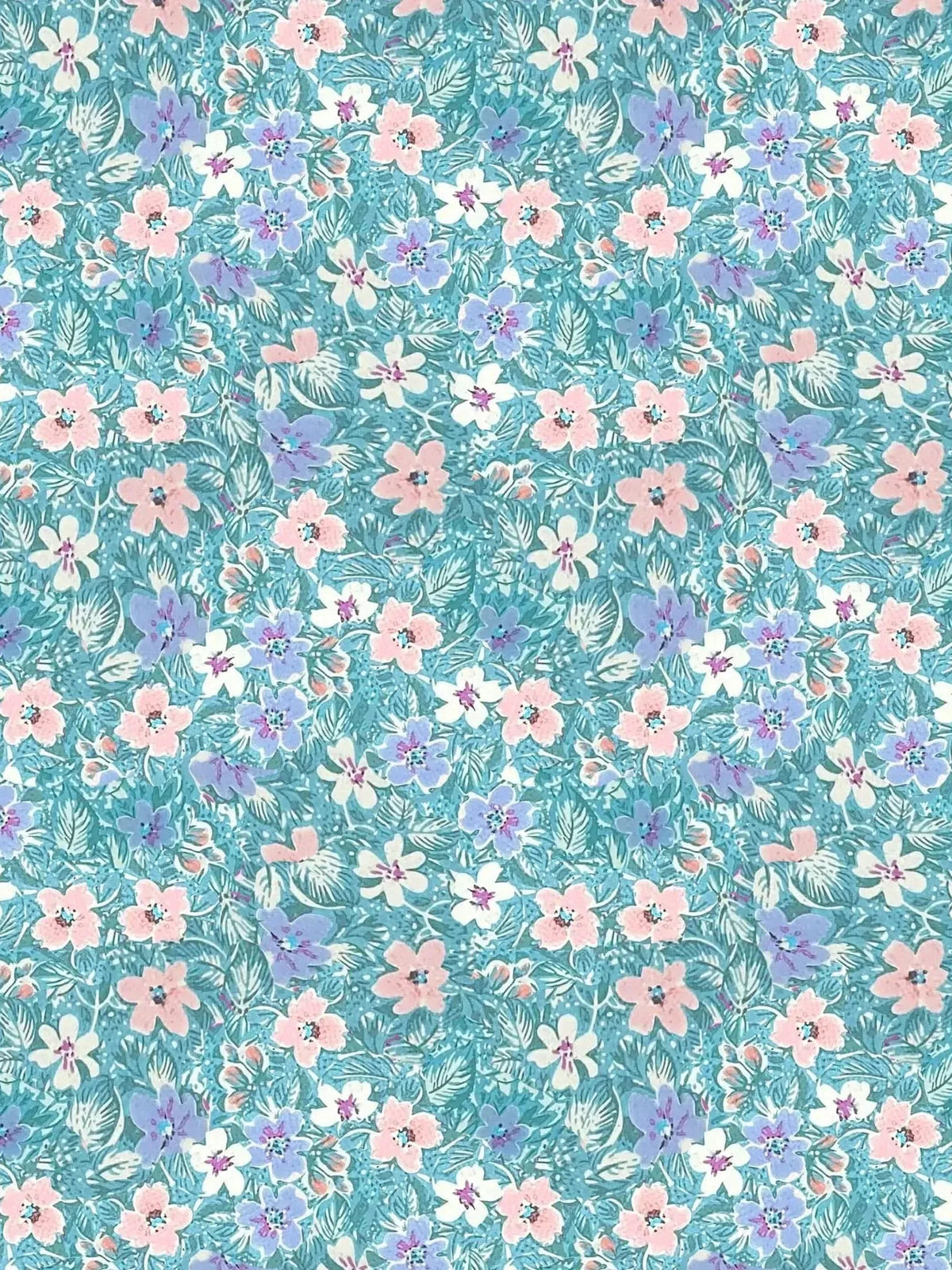 Light blue wallpaper with pink, white, and purple flowers and green leaves.