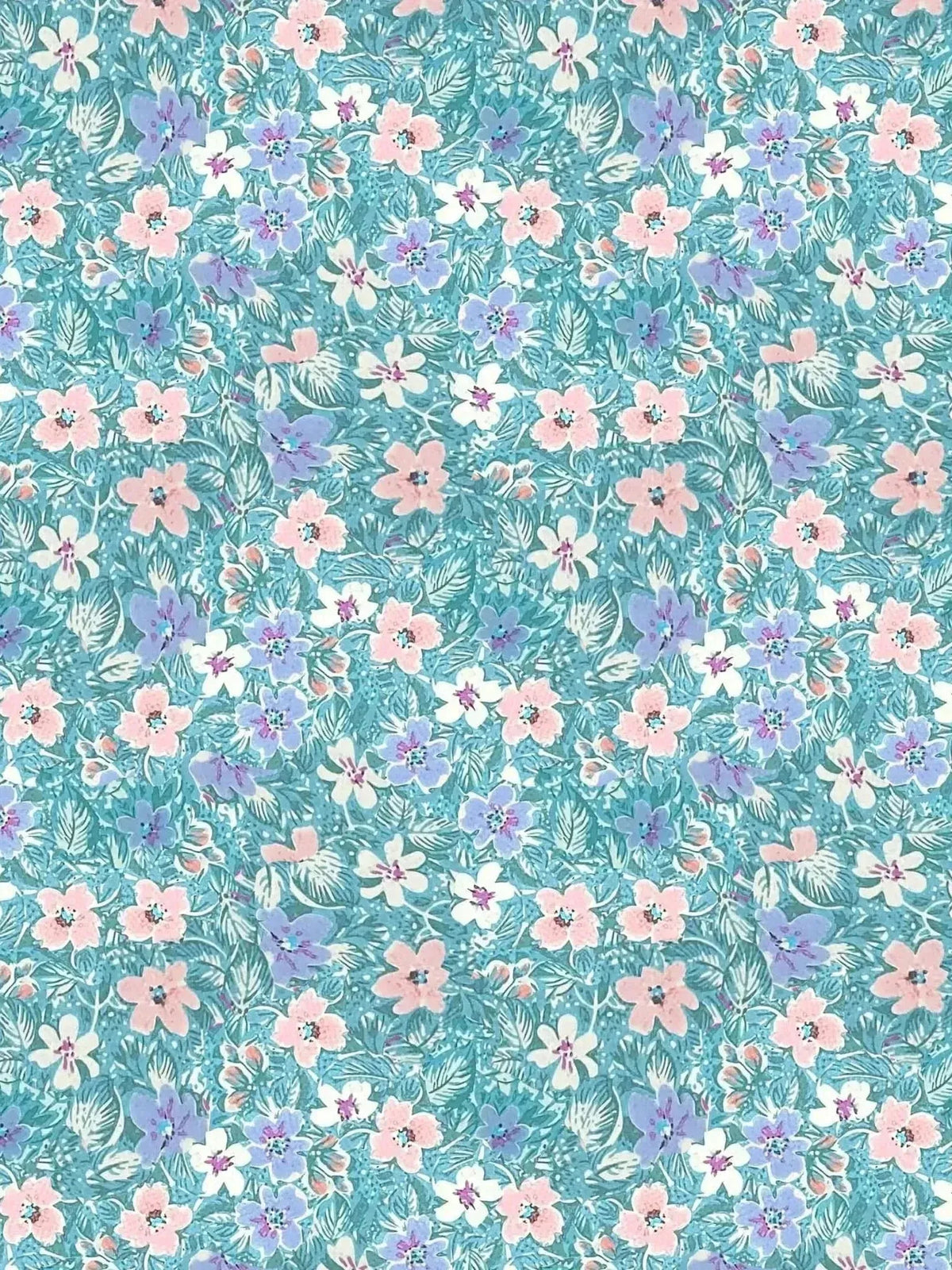 Light blue fabric with a pattern of pink, purple, and white flowers and green leaves.