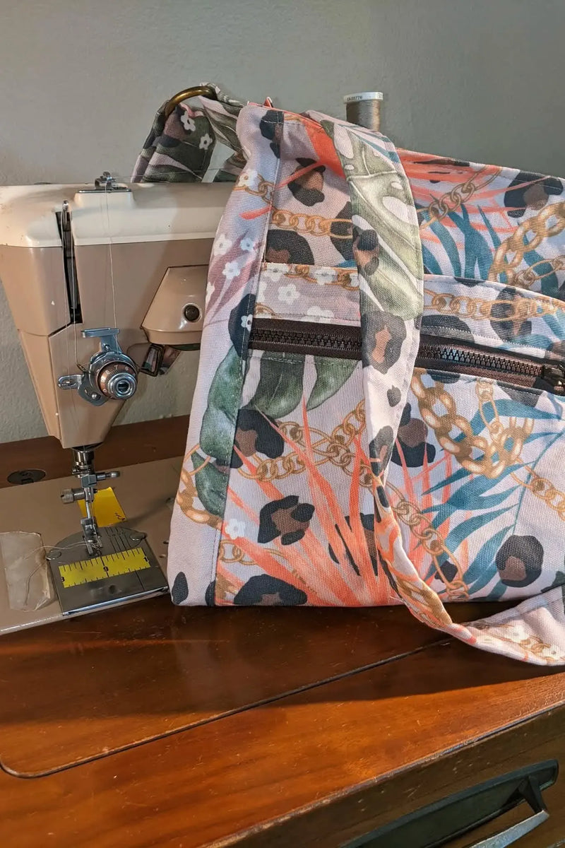 A sewing machine with a bag made from Luxe Leopard fabric.