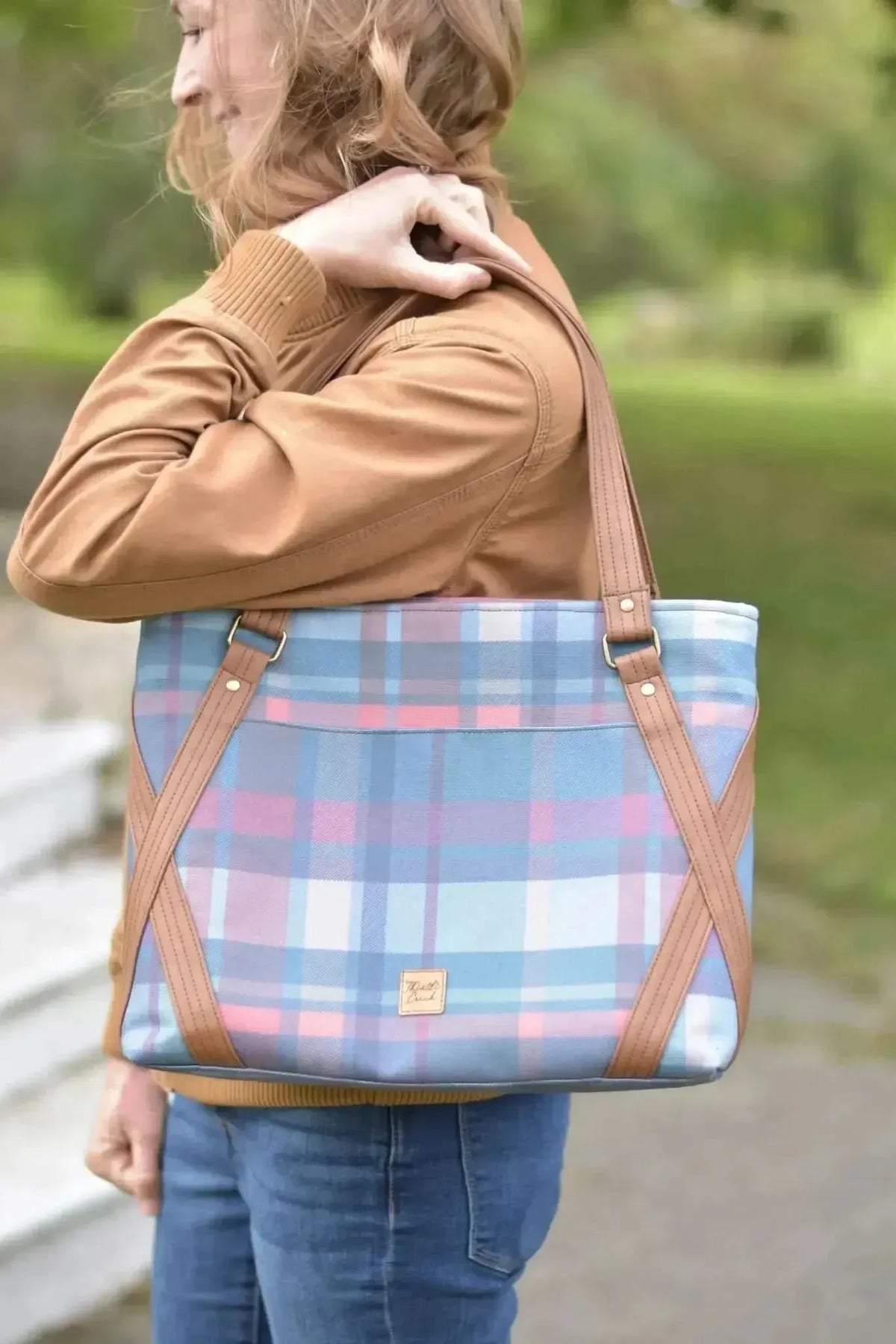 Fall teal plaid fabric print with blue, pink, and brown plaid pattern.