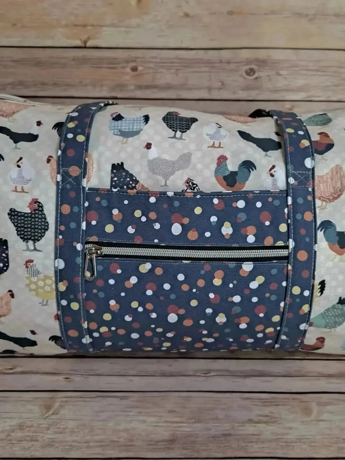 Patchwork fabric featuring a colorful print of various chickens on a light background.