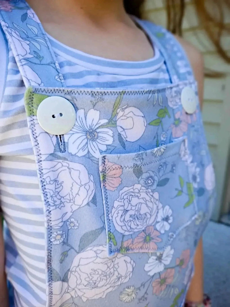 Dusty blue Japanese floral fabric with white and pink flowers.