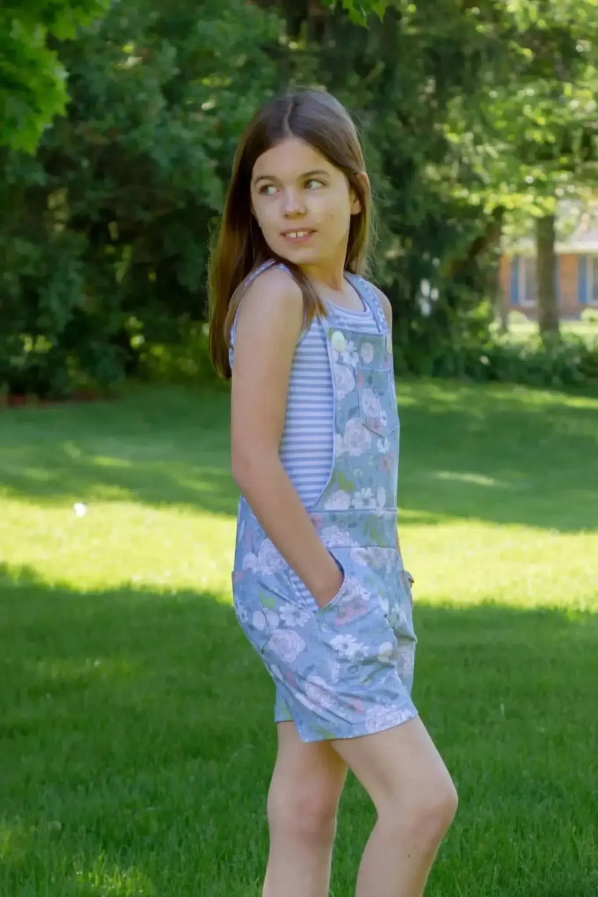 Dusty blue Japanese floral fabric swatch with pink flowers on a light background.