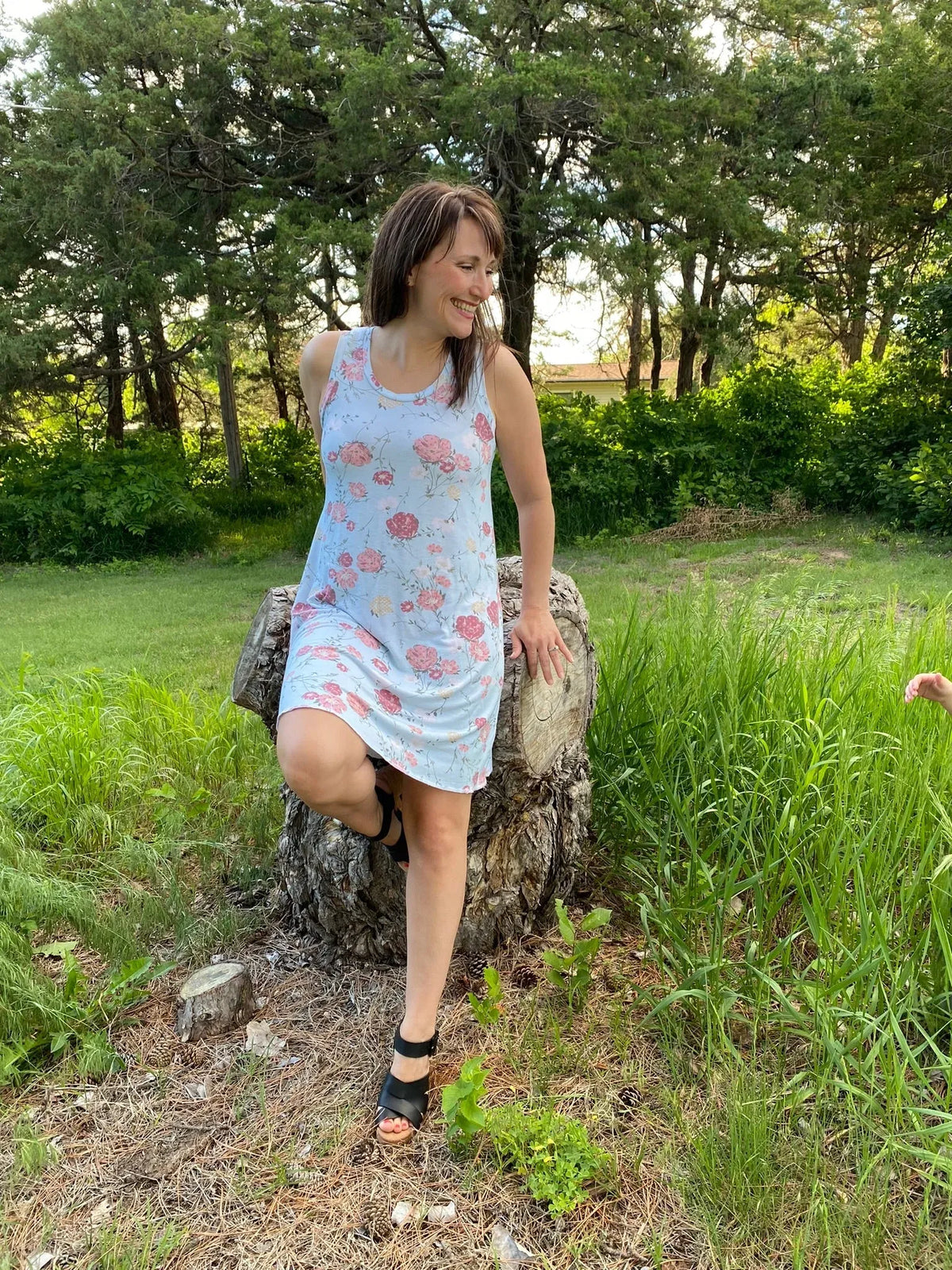 Modern Blooms floral print fabric with pink flowers on light blue background.