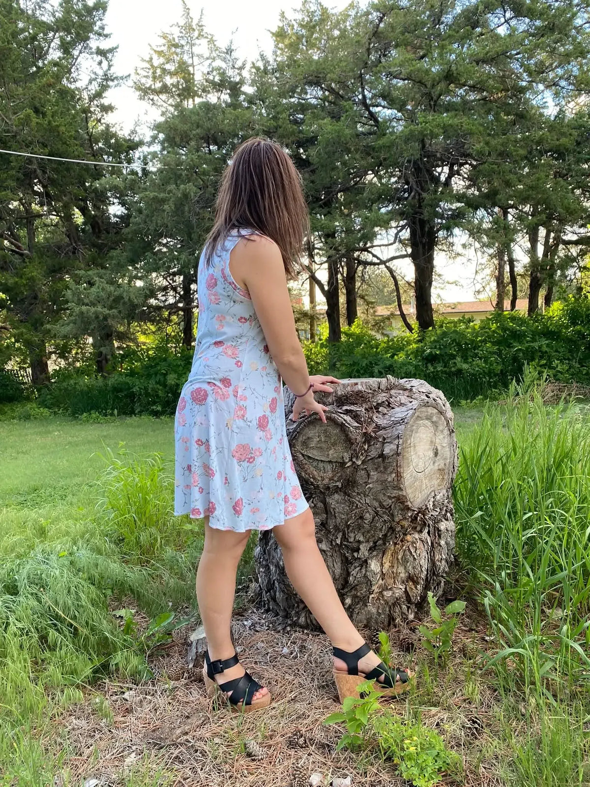 Modern Blooms floral print fabric with pink flowers on light blue background.
