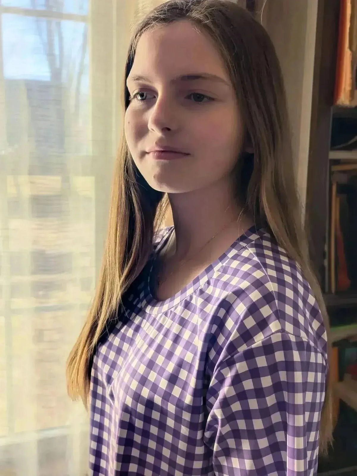 Violet gingham fabric with purple and white checkered pattern on a woven base.