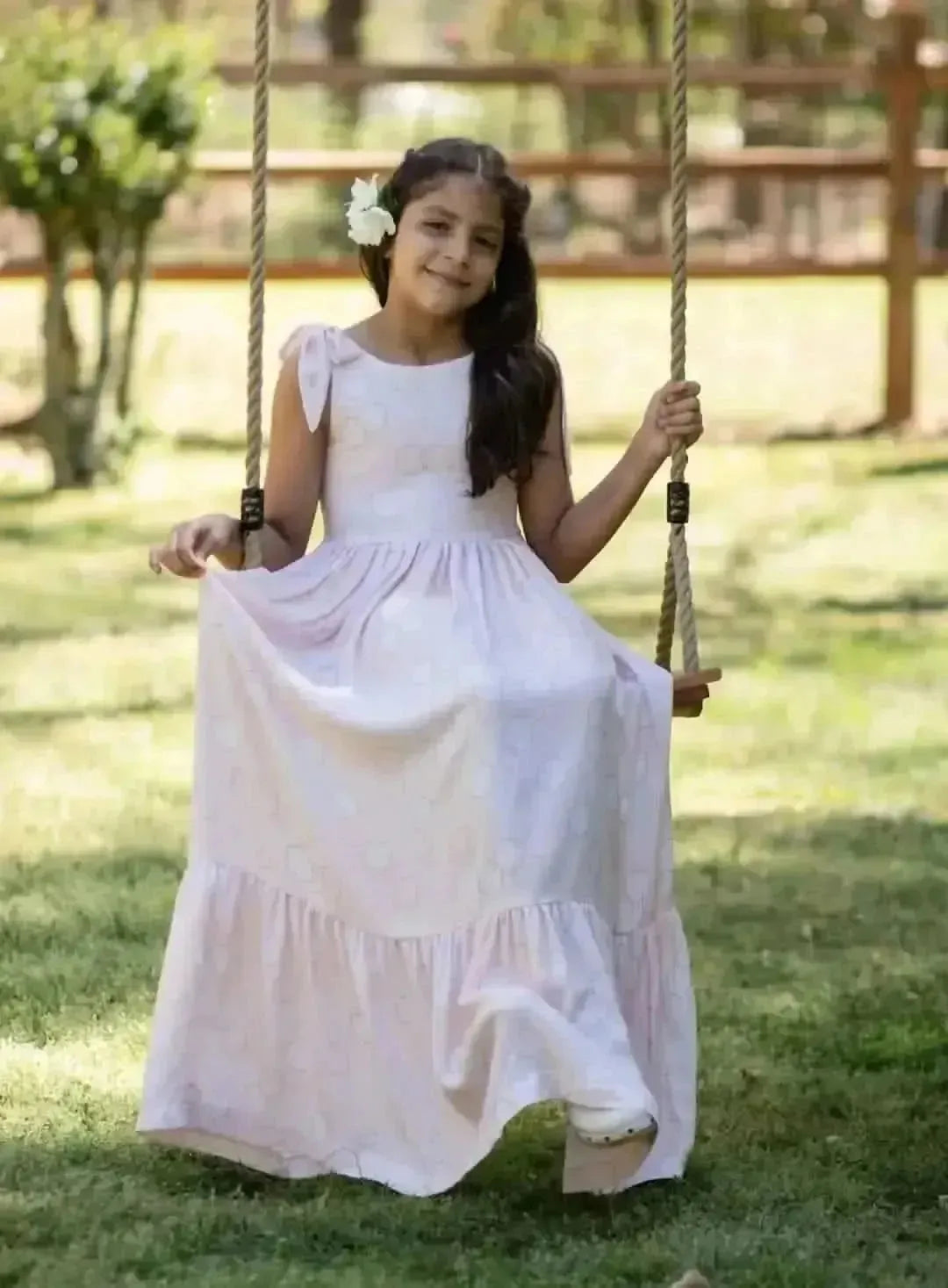 Peach fabric with geometric hexagon print in soft, peachy tones.