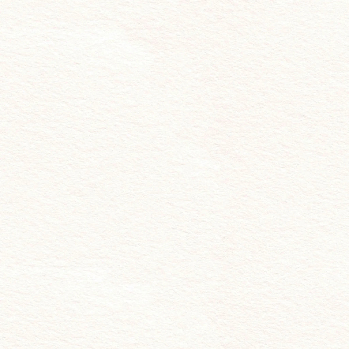 A close-up view of a light pink watercolor paper with a textured surface.