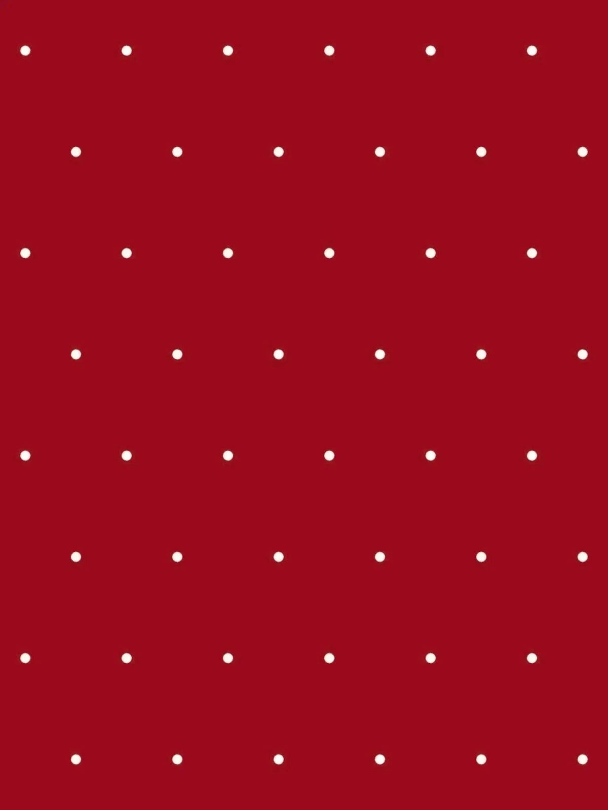 Red polka dot print fabric with white dots on a solid red background.