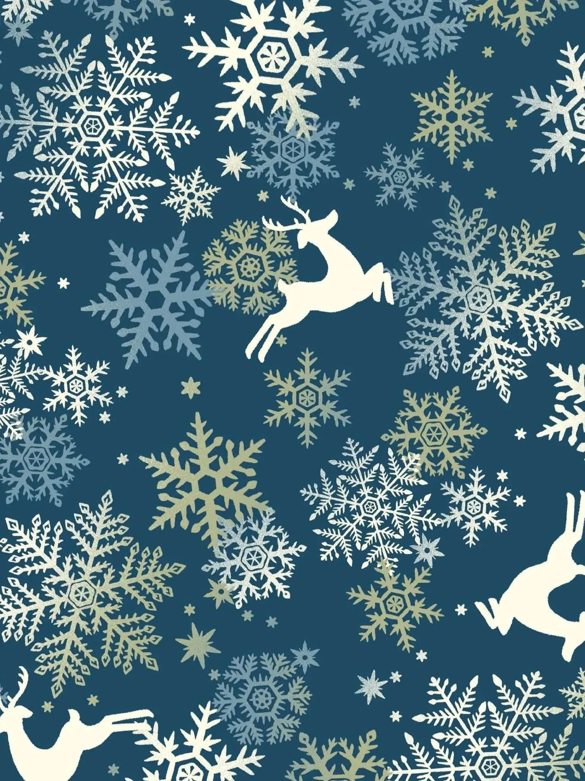 Holiday fabric with navy background, white snowflakes, and leaping reindeer silhouettes.