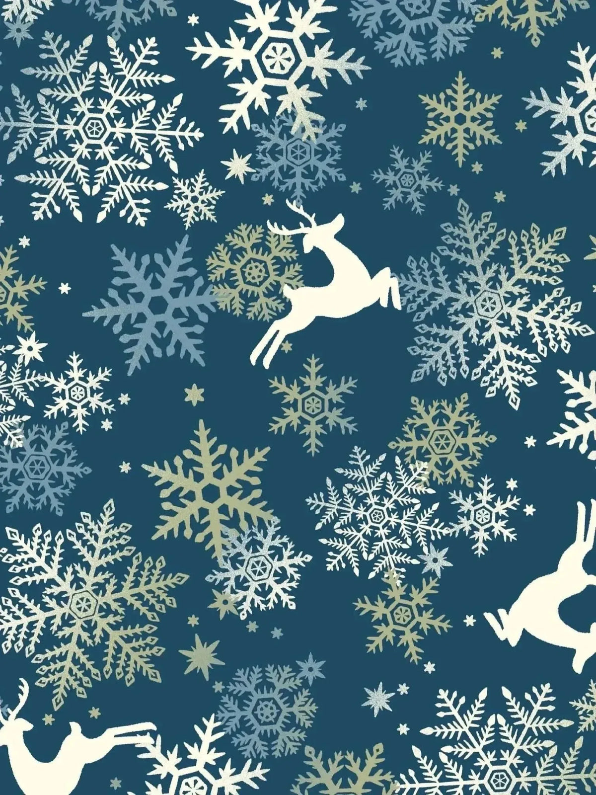 Holiday fabric with navy background, white snowflakes, and leaping reindeer silhouettes.