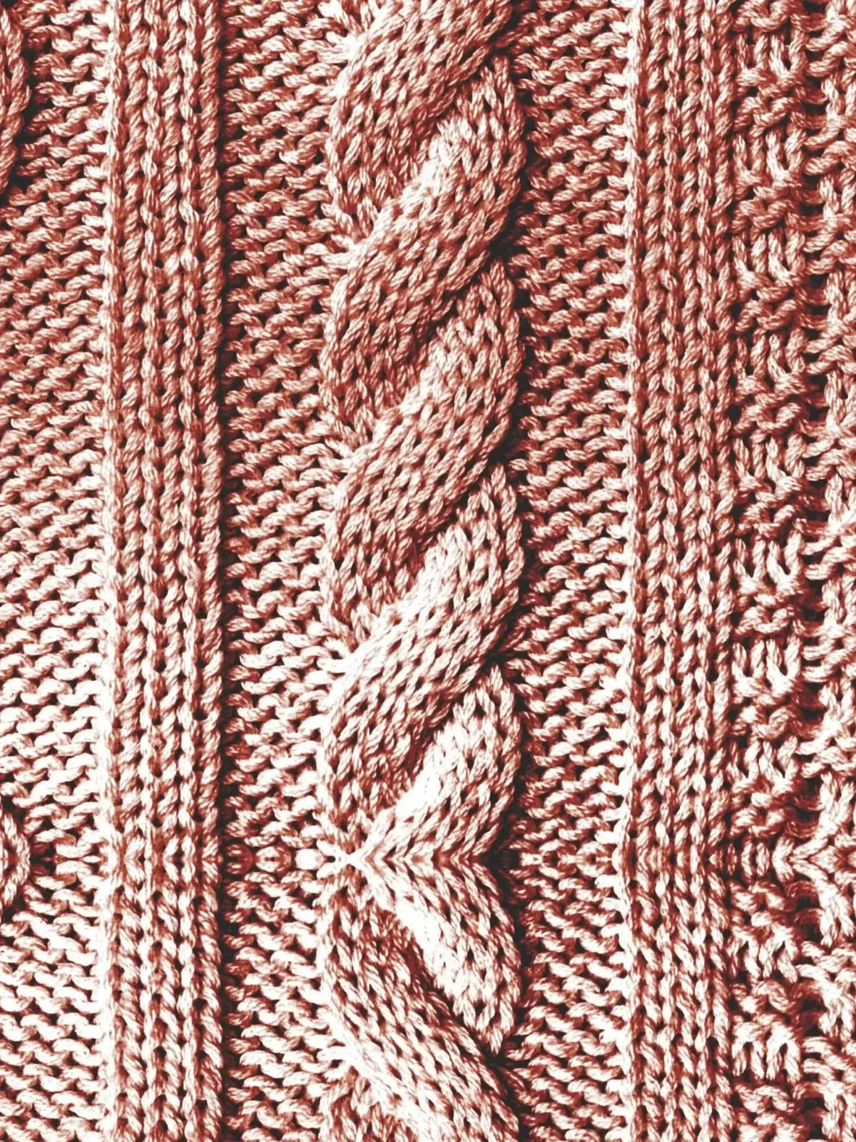 Close-up of red modal French terry fabric with cable knit texture.