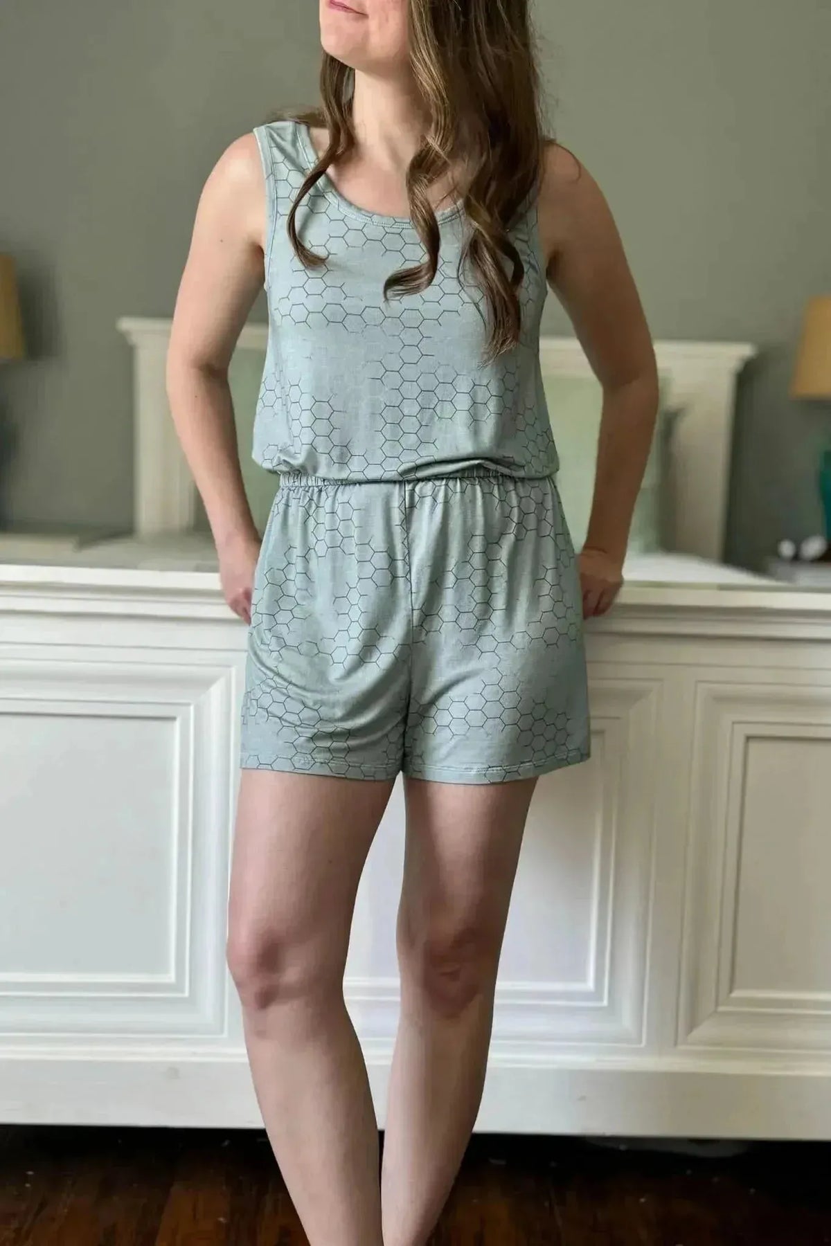 Light green honeycomb geometric print fabric swatch in a sewn sleeveless romper.