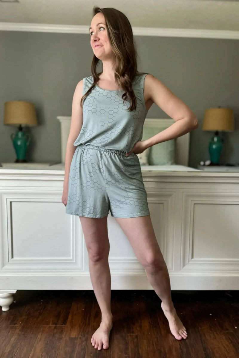 A woman models a light green honeycomb-patterned romper.