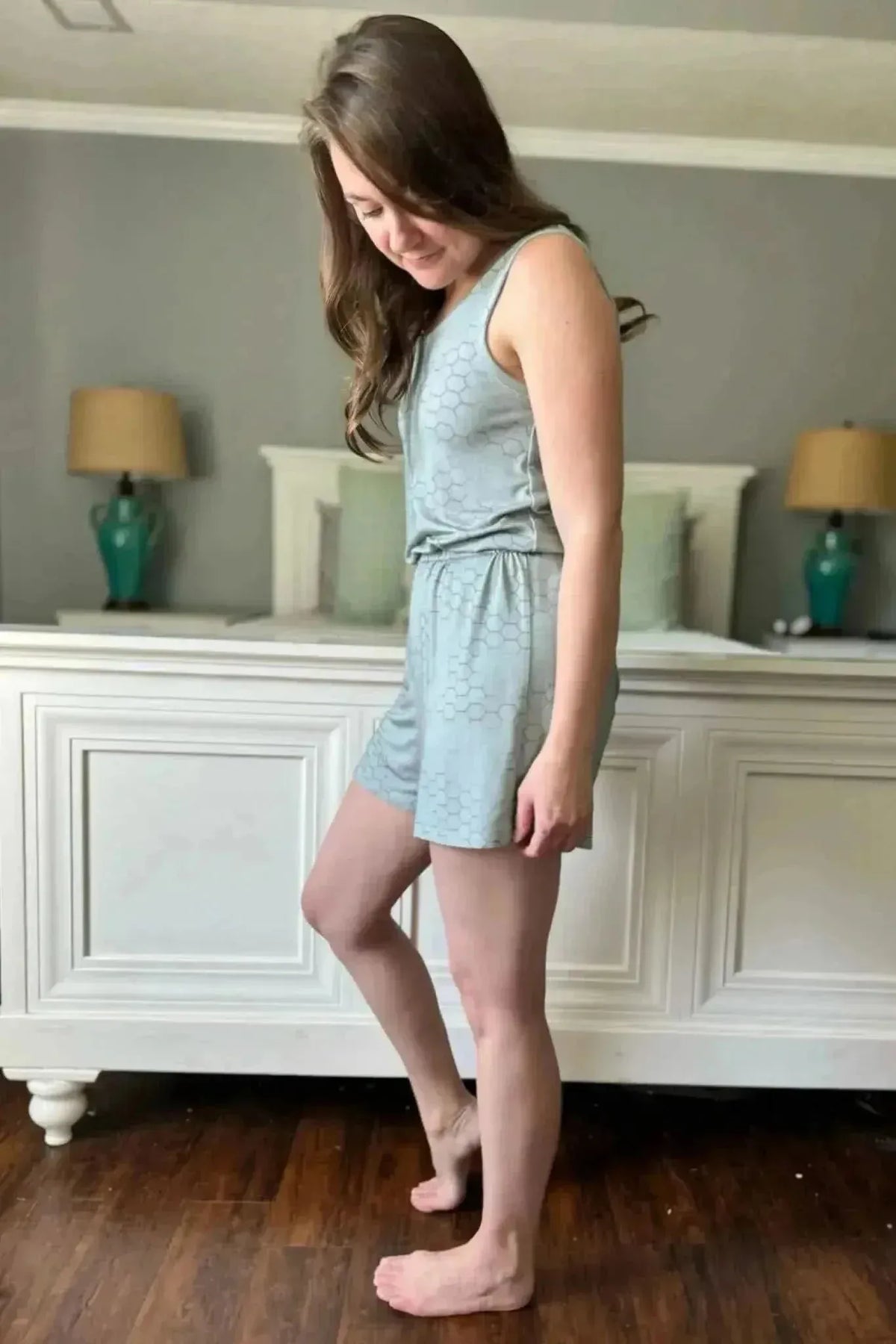 Light green honeycomb geometric print fabric swatch in a sewn garment.