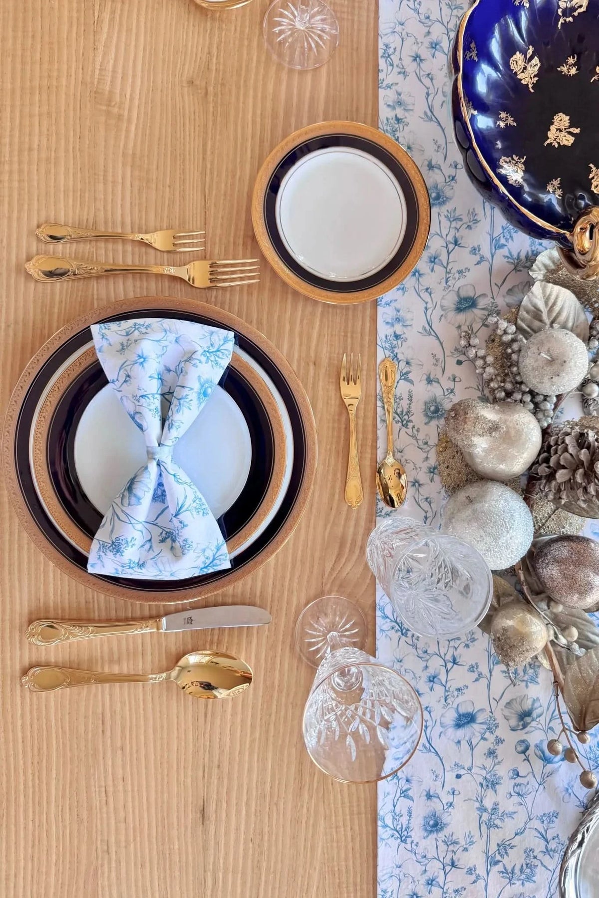 A blue and white floral patterned fabric is used as a table runner.
