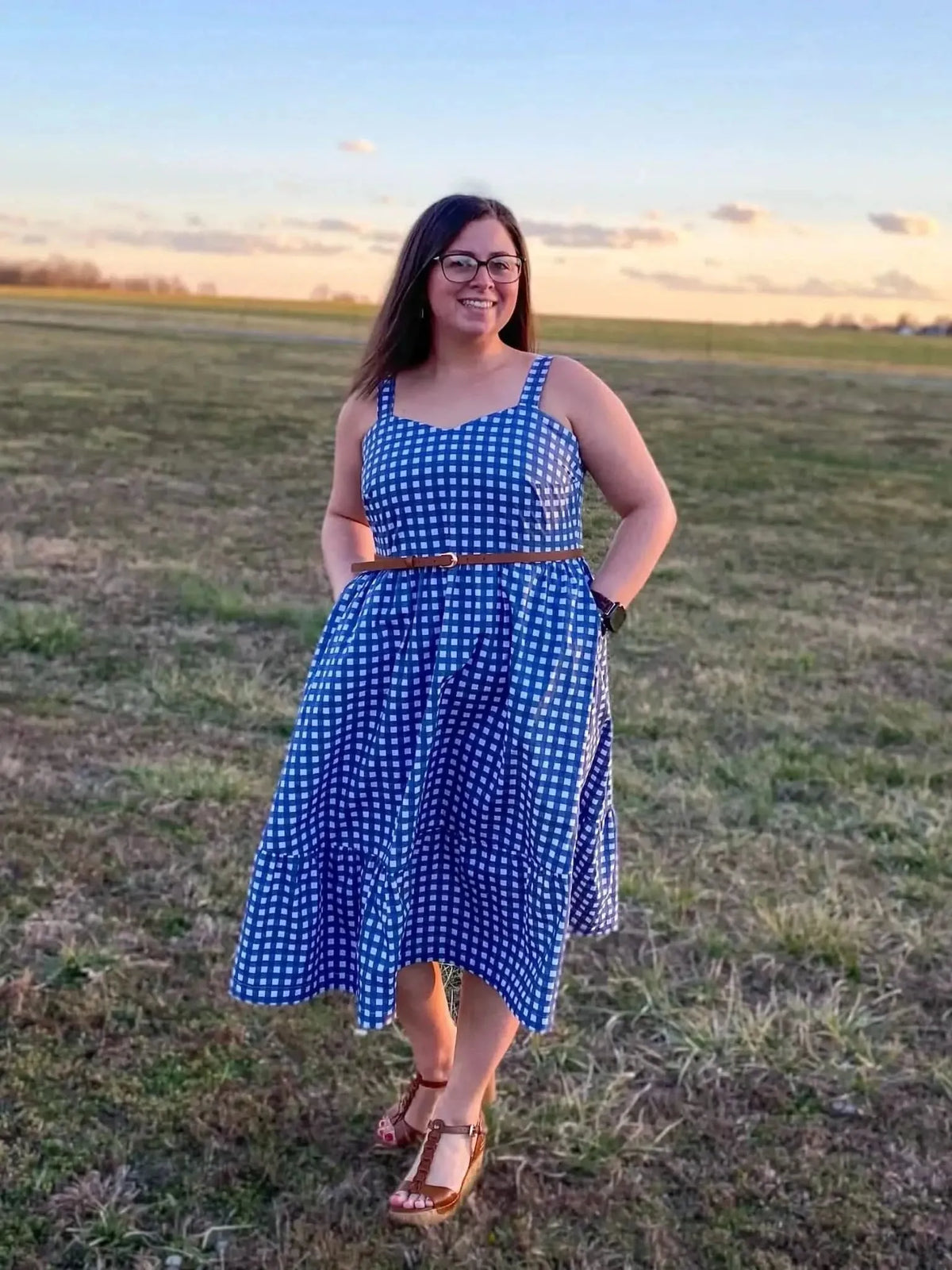 Navy gingham checkered fabric with small squares on a woven base.