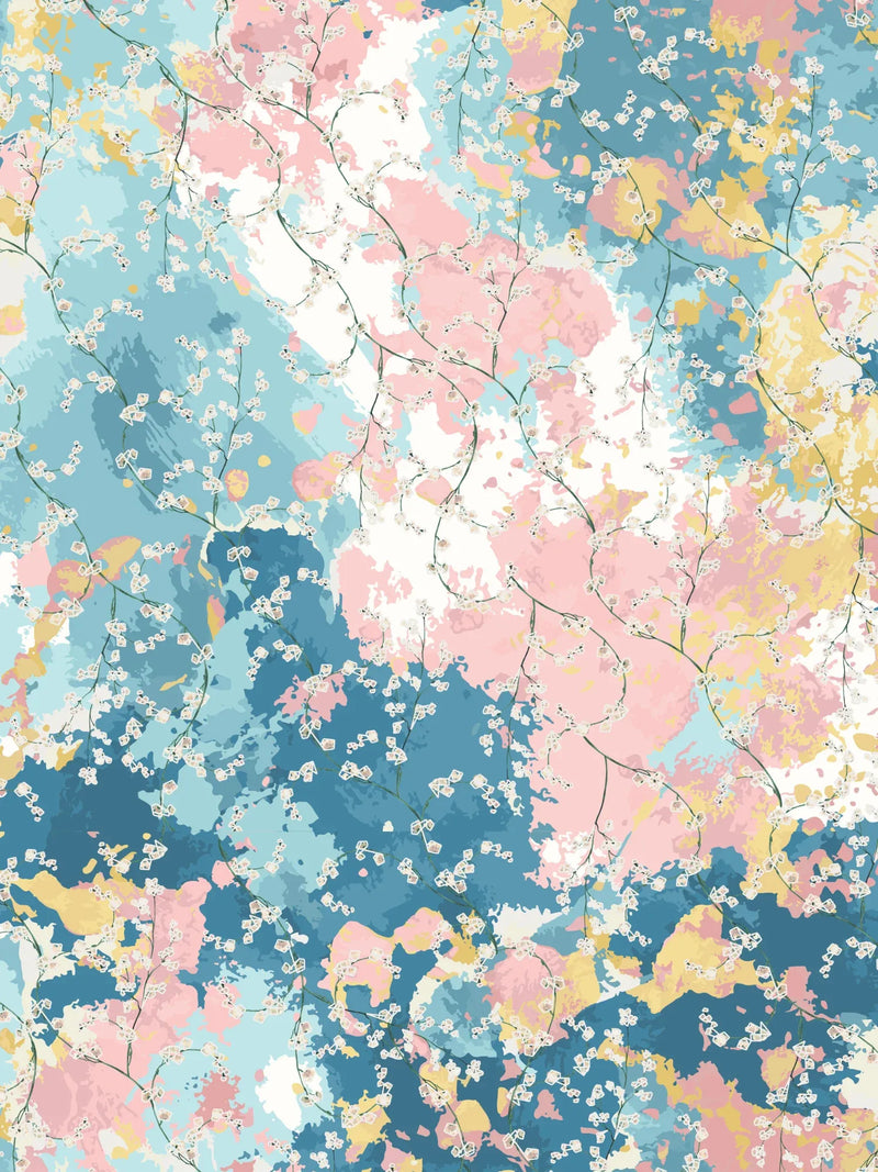 Fabric with a colorful abstract background and delicate white floral branches.
