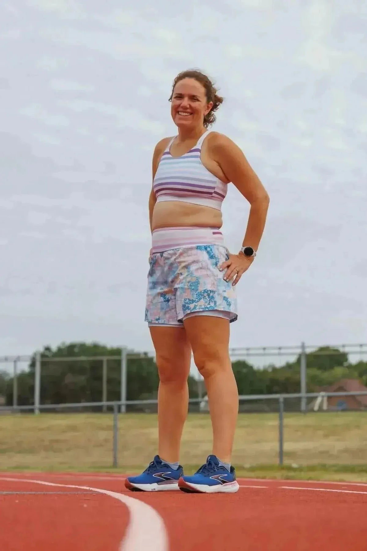 Blue-pink abstract floral faith-based print fabric with stretchy athletic shorts and top.