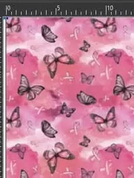 Pink fabric with butterflies and breast cancer awareness ribbons.