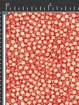 Red fabric with a pattern of small white flowers.