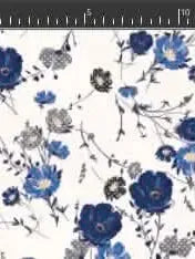 A white fabric features a pattern of blue and gray flowers with green stems.