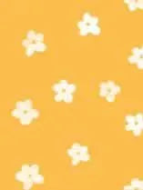 Orange fabric with a spread out white floral pattern.