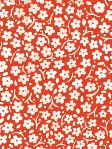 Red fabric with a pattern of small white flowers and leaves.