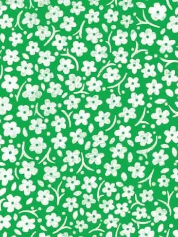 Green fabric with a pattern of small white flowers and leaves.
